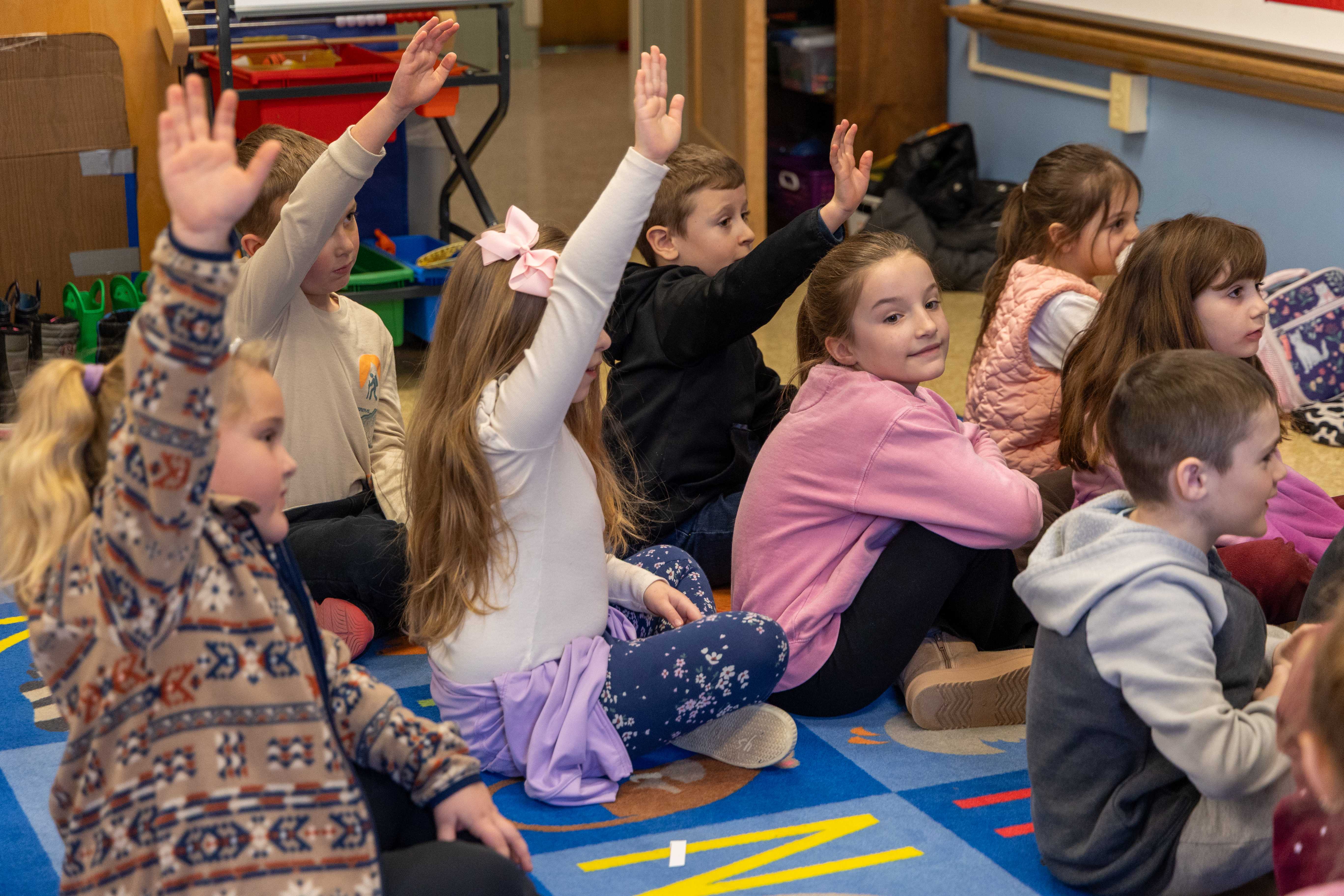 Students raise their hands